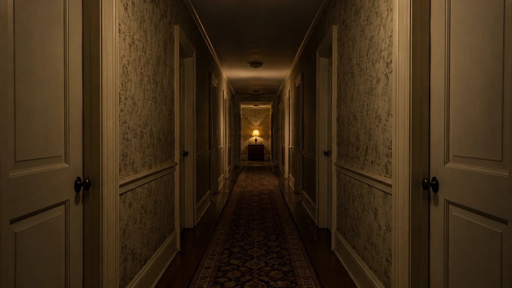 A quiet vintage hotel corridor fades into soft amber light.