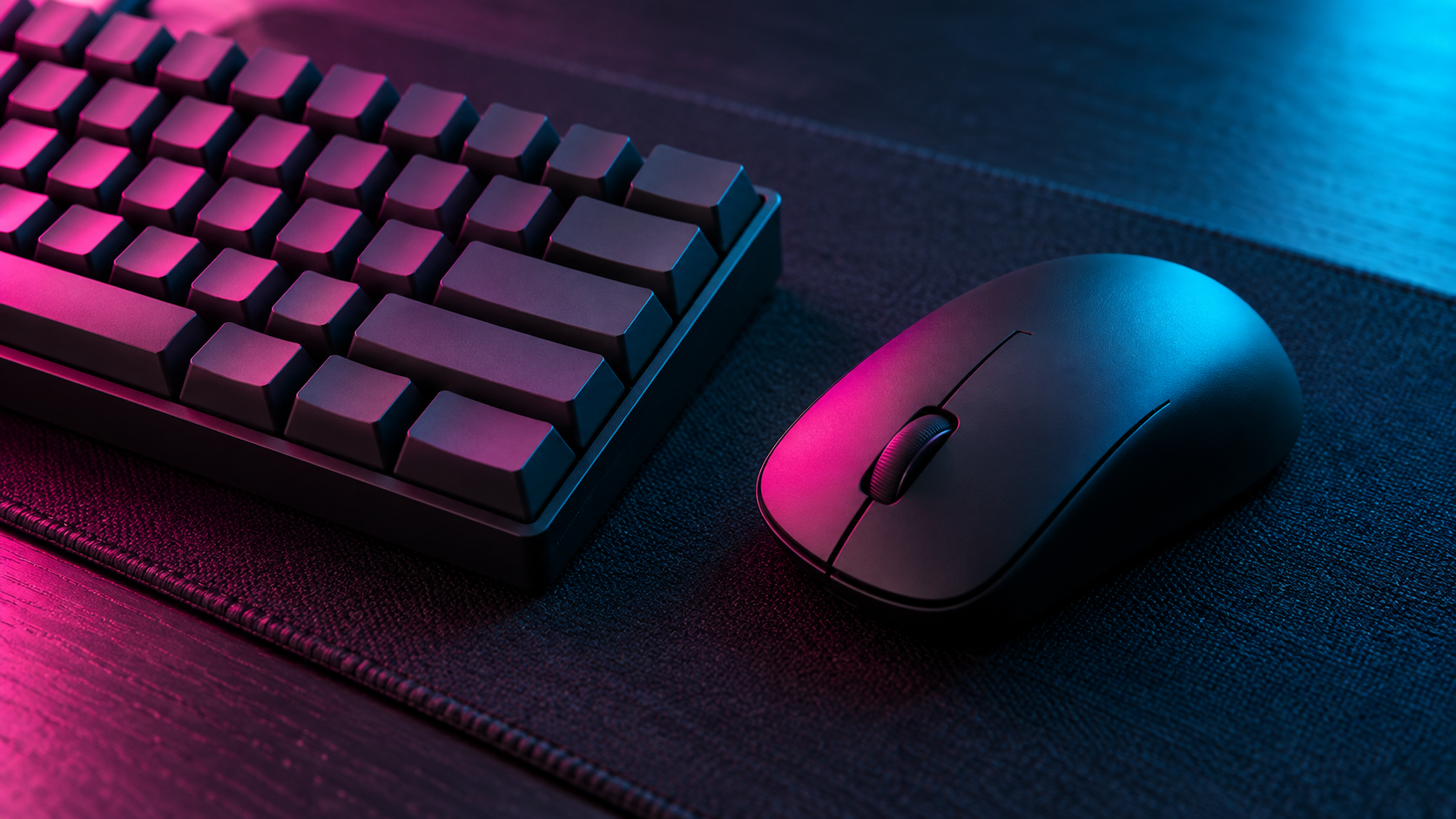Blank keyboard and mouse under neon lighting